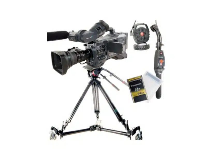 Professional video camera on wheeled tripod with remote controls and Panasonic P2 memory card displayed on white background. The setup includes a high-end camera securely mounted on a rolling tripod, easy-to-use remote controls for operation, and a Panasonic P2 memory card with protective case—ideal for professional video recording and media production needs.