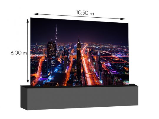 LED wall 10.50m x 6.00m – 5.9mm INFiLED ER5pro rental screen displaying a vibrant nighttime cityscape with brightly lit skyscrapers and glowing roads, shown on a large, high-resolution rectangular LED display panel.