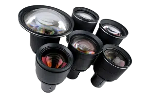 Six camera lenses with large glass elements—each featuring different focal lengths and specialty lens coatings—are neatly arranged in a semi-circle on a white background, showcasing a variety of professional photography lenses suitable for DSLR and mirrorless cameras.