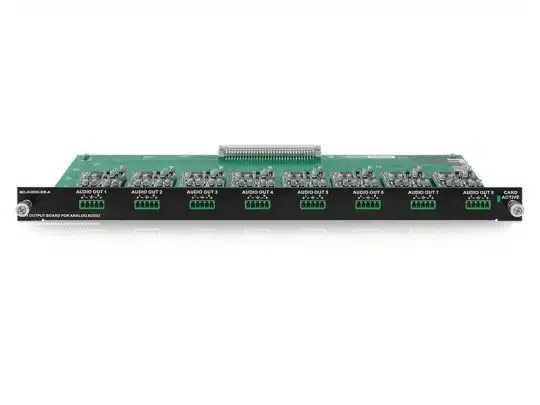 Green circuit board for audio systems with multiple electronic components, labeled AUDIO OUT on a black front panel. Features eight output ports in two rows with screw terminals and a CARD FAULT indicator light on the right. Suitable for professional audio installations and rack-mounted sound systems.