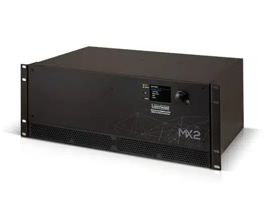 Lightware MX2 rack-mounted matrix switcher—black electronic device with front control buttons, indicator lights, small display screen, and ventilation grilles.