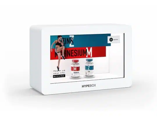 21.5 Zoll Full HD Hypebox – Screensource HB21L display box showcasing red magnesium and blue zinc supplement bottles, with a running woman in the background and bold “Zink Magnesium” text.