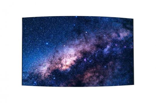 Milky Way galaxy wall art print showing a dense field of stars and vibrant cosmic clouds against a dark night sky, framed with a curved rectangular border on a white background.