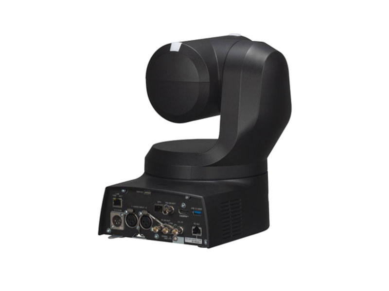 Black professional PTZ (pan-tilt-zoom) video camera with multiple input and output ports on its base, displayed against a plain white background. The camera is positioned to highlight its connectivity options and control buttons, ideal for live streaming or conference setups.