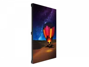 Large vertical LED display screen showing a vibrant hot air balloon over a desert landscape at night, with a starry sky above; product viewed from an angled side perspective.