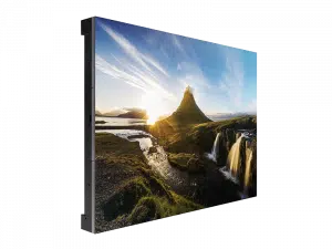 Rectangular LED display panel showing a colorful landscape image with mountains, river, waterfall, and sunrise or sunset lighting; the screen is angled on a white background.