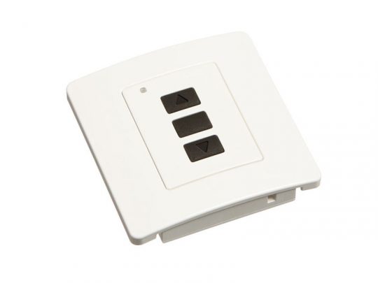 Somfy wall-mounted remote control panel with three black buttons—an up arrow, a central square, and a down arrow—on a white rectangular surface, used for operating automated blinds or shades.