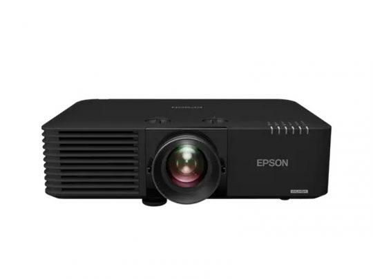 Black Epson projector, front view, on white background; features a large central lens, ventilation grills on the left side, and Epson logo on the right.