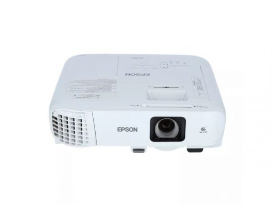 Epson projector in white color, featuring a front right lens, front left ventilation grille, and top control buttons; displayed on a plain white background.