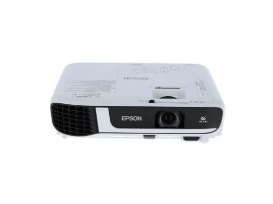 Front view of a white Epson projector with lens on the right, ventilation grill on the left, and control buttons plus labels visible on top—ideal for home theater or office presentations.