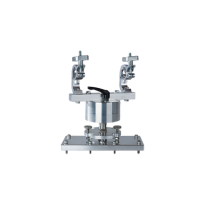 Logando scientific instrument: A compact, metallic device with two adjustable arms mounted on a sturdy rectangular base. The precision-engineered tool features symmetrical design, visible bolts, and fittings, suitable for laboratory use.