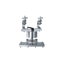 Logando scientific instrument: A compact, metallic device with two adjustable arms mounted on a sturdy rectangular base. The precision-engineered tool features symmetrical design, visible bolts, and fittings, suitable for laboratory use.