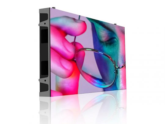 Close-up of an LED display screen showing a vibrant, colorful image of a person’s face holding eyeglasses, with lighting reflections; the screen is angled on a white background. Perfect for SEO: high-resolution LED display panel for vivid image presentations.