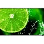 A close-up of a fresh green lime slice with water splashing around it, set against a vibrant green and black background. The juicy texture and vivid color of the lime are highlighted, making it look refreshing and appetizing. Perfect for products related to limes, citrus fruit, or beverages.