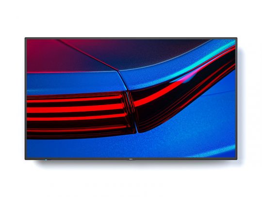 Samsung 4K Ultra HD Smart TV with Thin Black Bezel, displaying a close-up of a modern car’s rear light in vivid red, blue, and black colors. The flat-screen design emphasizes the TV’s sleek appearance and vibrant picture quality.
