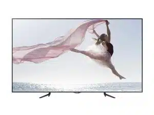 95 Zoll LED LCD Display Samsung ME95C mieten - das Produktbild zeigt das große, flache Display mit schlankem schwarzen Rahmen. Auf dem Bildschirm ist eine Ballerina abgebildet, die am Meer elegant mit wehendem rosa Stoff federt, während im Hintergrund die Sonne scheint. Ideal für gestochen scharfe Präsentationen und auffällige Werbeauftritte.