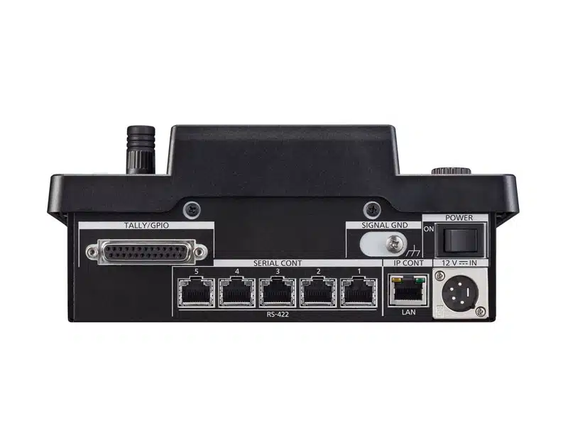 Rückansicht der Panasonic AW-RP60GJ Remote-Kamerasteuereinheit: Zu sehen sind TALLY/GPIO-Anschlüsse, mehrere Ethernet LAN-Ports, ein Netzschalter, ein 12V DC-Eingang und ein runder Steckanschluss rechts - professionelle PTZ-Kamera-Steuereinheit zur Miete.