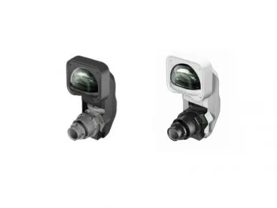 Zwei kompakte Überwachungskameras, Modell "CompactCam", in Schwarz und Weiß nebeneinander vor weißem Hintergrund. Beide Kameras haben ein großes Objektiv und ein modernes, schlankes Design - ideal zum Mieten oder Kaufen.