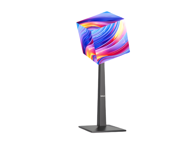 Unilumin Cube Stand mit bunter, abstrakter Würfelskulptur darauf vor weißem Hintergrund, modernes Design, Produktbild.