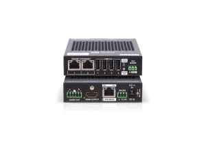 Auf dem Foto sind zwei schwarze, rechteckige Netzwerkgeräte vom Typ [Produktname] zu sehen, die übereinander gestapelt sind. Sie verfügen über verschiedene Anschlüsse wie Ethernet, HDMI, USB, RS-232 und Audio. Das Foto zeigt die Geräte vor einem weißen Hintergrund – ideal für barrierefreies Arbeiten im Netzwerkbereich.